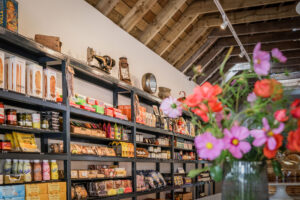 farm shop shelves with flowers 