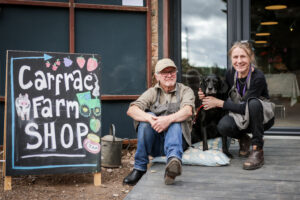 Trudi, Eric and Pip sitting outside Carfrae Farm Shop